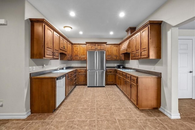 17793 Bluffview Dr, Springdale, AR 72764 - kitchen with freestanding refrigerator, dishwasher, brown cabinetry, recessed lighting, and stovetop