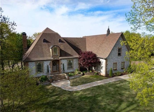 17793 Bluffview Dr, Springdale, AR 72764 - french country style house featuring a chimney, a front lawn, and stone siding