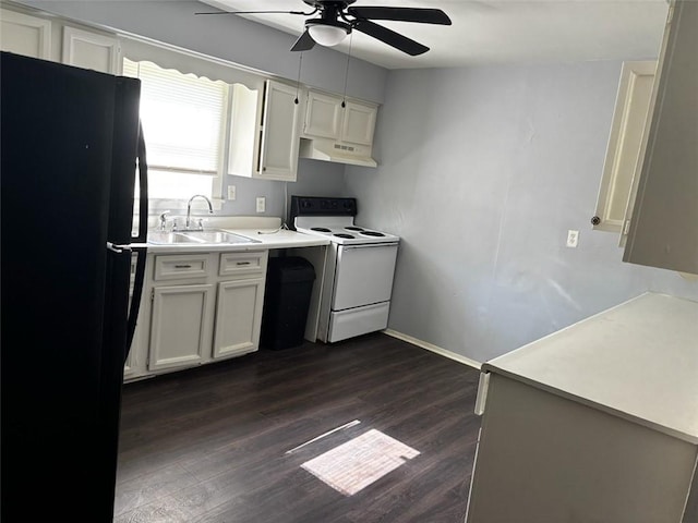 205 10th St, Danville, AR 72833 - kitchen with white electric stove, freestanding refrigerator, ceiling fan, a sink, and under cabinet range hood