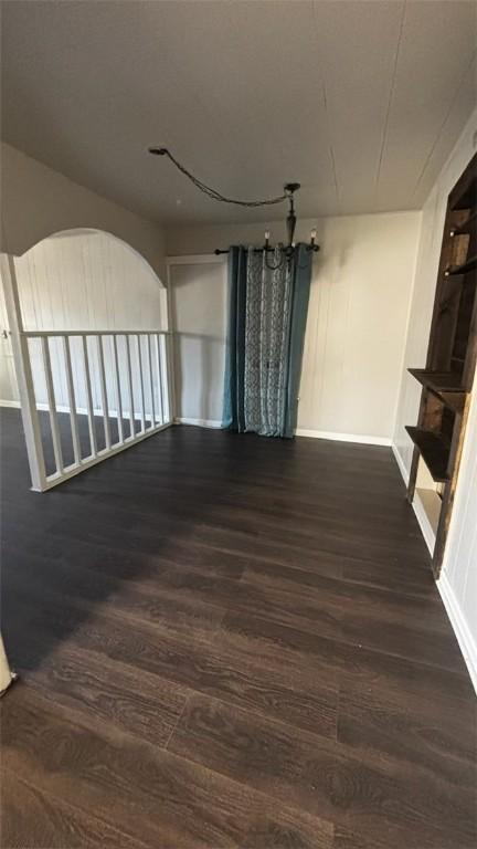205 10th St, Danville, AR 72833 - unfurnished room with dark wood-type flooring and baseboards