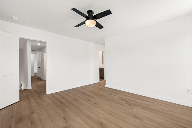 730 N 5th St, Rogers, AR 72756 - unfurnished room featuring wood finished floors, a ceiling fan, and a smoke detector