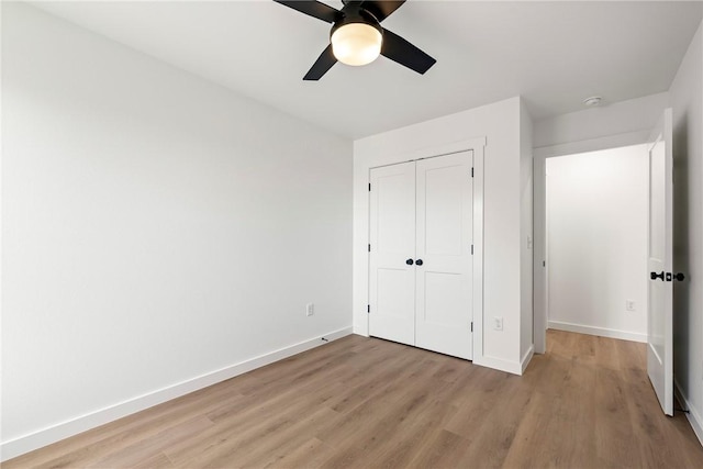 730 N 5th St, Rogers, AR 72756 - unfurnished bedroom featuring light wood-type flooring, a closet, and a ceiling fan