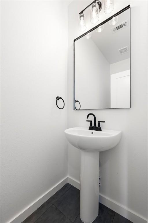 730 N 5th St, Rogers, AR 72756 - bathroom featuring tile patterned floors and baseboards