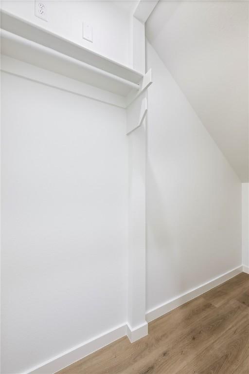 730 N 5th St, Rogers, AR 72756 - spacious closet with vaulted ceiling and light wood-style floors
