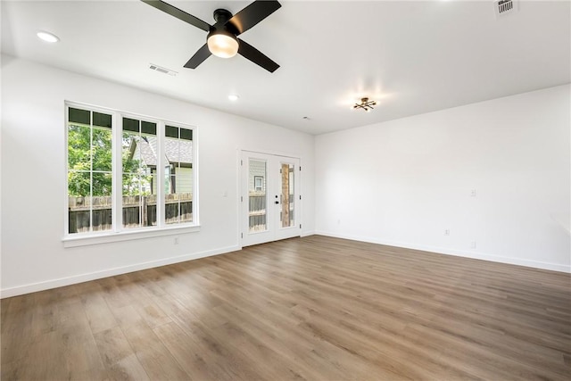 730 N 5th St, Rogers, AR 72756 - spare room featuring wood finished floors, ceiling fan, and recessed lighting