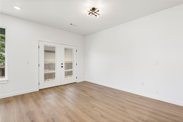 730 N 5th St, Rogers, AR 72756 - empty room featuring french doors, light wood finished floors, and recessed lighting