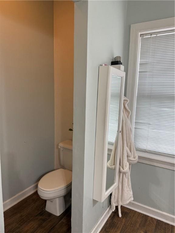 2110 W 8th St, Russellville, AR 72801 - bathroom featuring wood finished floors, baseboards, and toilet