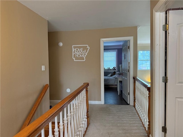2110 W 8th St, Russellville, AR 72801 - corridor featuring an upstairs landing, light carpet, and baseboards