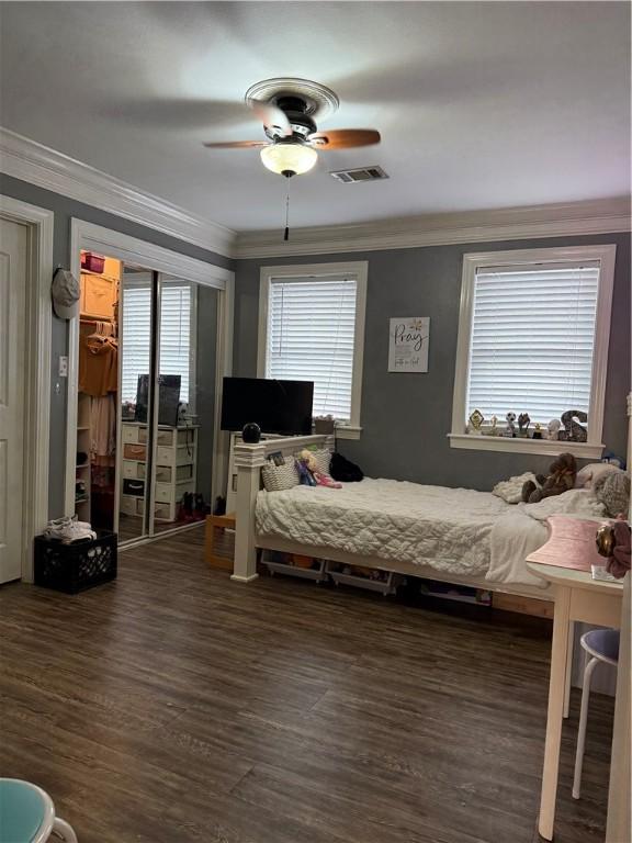 2110 W 8th St, Russellville, AR 72801 - bedroom with ornamental molding, wood finished floors, and a ceiling fan