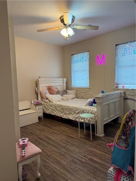 2110 W 8th St, Russellville, AR 72801 - bedroom featuring dark wood-style flooring and ceiling fan