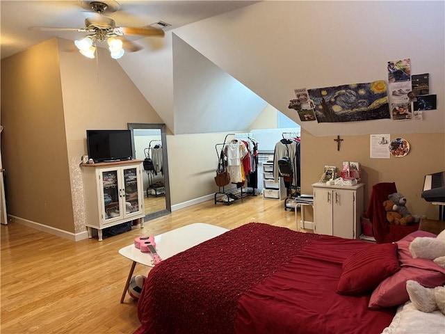 2110 W 8th St, Russellville, AR 72801 - bedroom with wood finished floors, baseboards, lofted ceiling, and ceiling fan