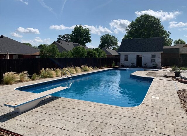 2110 W 8th St, Russellville, AR 72801 - view of swimming pool with a patio, a fenced backyard, an outdoor structure, and a diving board