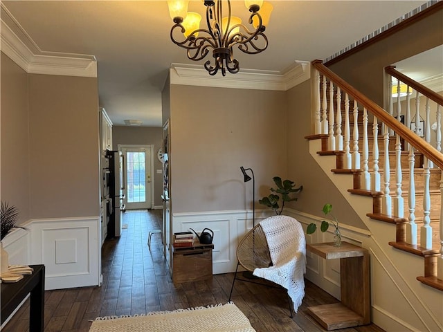 2110 W 8th St, Russellville, AR 72801 - staircase featuring a chandelier, wood-type flooring, a decorative wall, a wainscoted wall, and ornamental molding