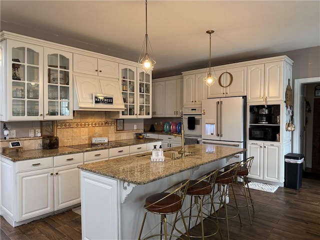 2110 W 8th St, Russellville, AR 72801 - kitchen featuring black electric stovetop, high end white refrigerator, dark wood-style floors, and white cabinetry