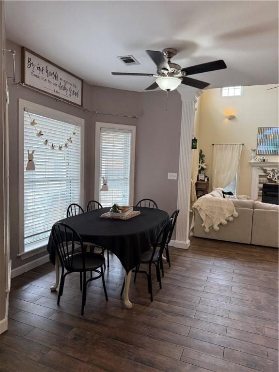 2110 W 8th St, Russellville, AR 72801 - dining space featuring baseboards, a ceiling fan, plenty of natural light, and dark wood-style floors