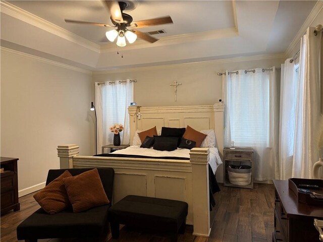 2110 W 8th St, Russellville, AR 72801 - bedroom with a raised ceiling, dark wood finished floors, a ceiling fan, and crown molding