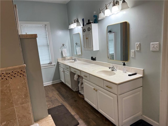 2110 W 8th St, Russellville, AR 72801 - bathroom with double vanity, wood finished floors, and baseboards