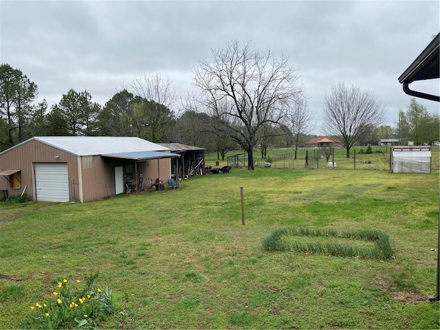 2230 Reed Ave, Springdale, AR 72764 - view of yard with an outbuilding, fence, and a detached garage