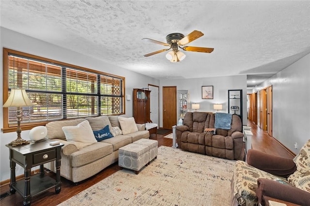 2230 Reed Ave, Springdale, AR 72764 - living area with a ceiling fan, a textured ceiling, and wood finished floors