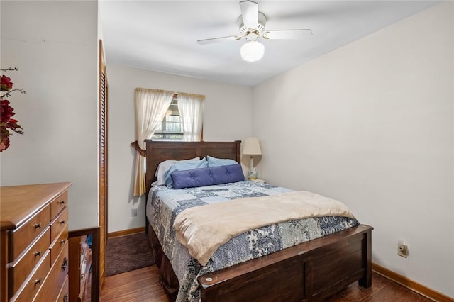 2230 Reed Ave, Springdale, AR 72764 - bedroom with baseboards, ceiling fan, and dark wood-type flooring