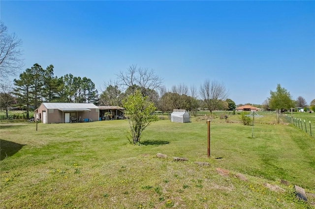 2230 Reed Ave, Springdale, AR 72764 - view of yard with an outbuilding and fence