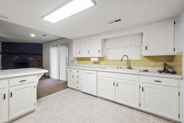 3906 Chapman Ave, Springdale, AR 72762 - kitchen with dishwasher, a sink, white cabinetry, light countertops, and recessed lighting