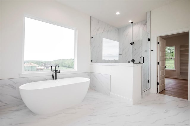 2608 NE Waterfall Ave, Bentonville, AR 72713 - full bath with marble tiled flooring, a marble finish shower, a soaking tub, and recessed lighting