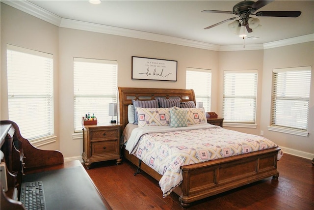 bedroom featuring baseboards, multiple windows, and dark wood finished floors