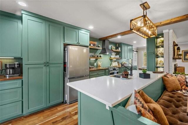 1617 N Applebury Dr, Fayetteville, AR 72701 - kitchen with green cabinets, wall chimney range hood, a sink, and stainless steel appliances