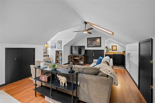 1617 N Applebury Dr, Fayetteville, AR 72701 - living room with light wood finished floors, ceiling fan, and vaulted ceiling