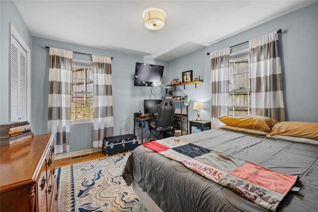 1617 N Applebury Dr, Fayetteville, AR 72701 - bedroom featuring visible vents and wood finished floors