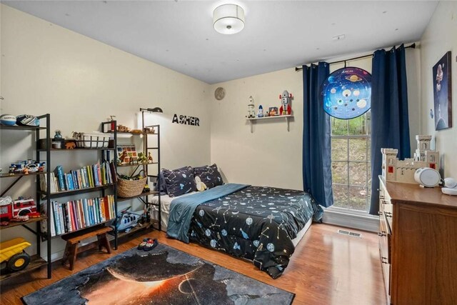 1617 N Applebury Dr, Fayetteville, AR 72701 - bedroom featuring wood finished floors and visible vents