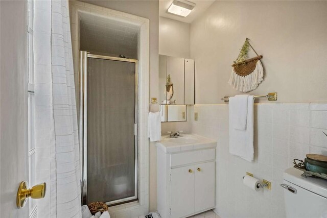 1617 N Applebury Dr, Fayetteville, AR 72701 - full bathroom with toilet, tile walls, a shower stall, vanity, and wainscoting