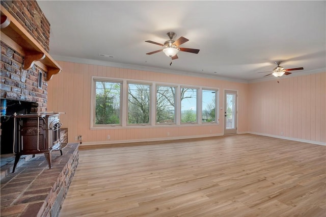 203 N Oklahoma Way, Fayetteville, AR 72701 - living area with a ceiling fan, ornamental molding, light wood-type flooring, baseboards, and wooden walls