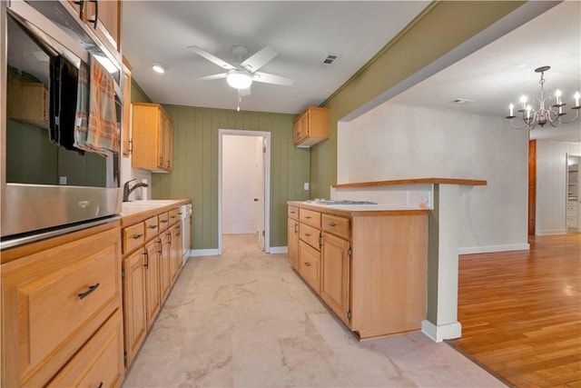 203 N Oklahoma Way, Fayetteville, AR 72701 - kitchen with a ceiling fan, baseboards, oven, a chandelier, and a sink