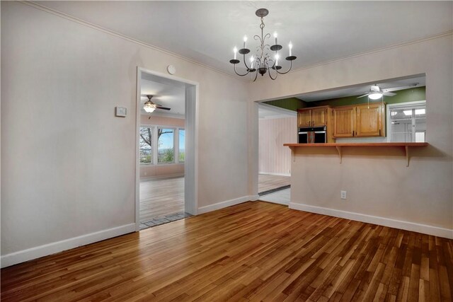 203 N Oklahoma Way, Fayetteville, AR 72701 - unfurnished dining area featuring a ceiling fan, light wood-type flooring, baseboards, a chandelier, and ornamental molding