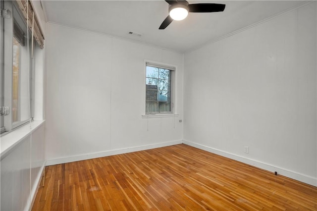 203 N Oklahoma Way, Fayetteville, AR 72701 - empty room with crown molding, a ceiling fan, wood-type flooring, and baseboards