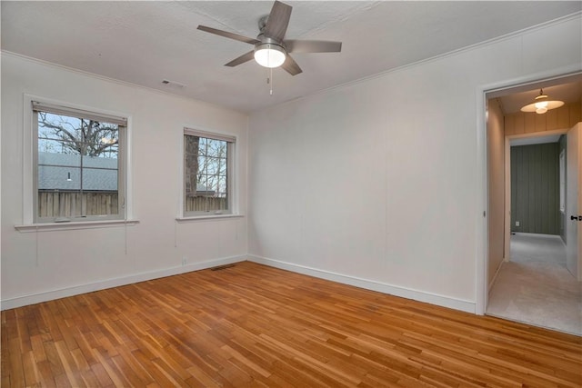 203 N Oklahoma Way, Fayetteville, AR 72701 - unfurnished room featuring wood-type flooring, a ceiling fan, baseboards, and crown molding