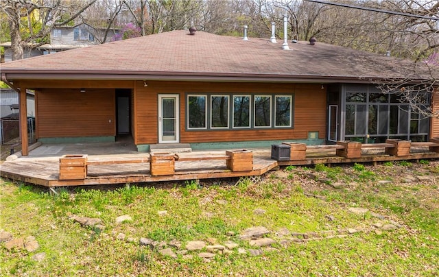 203 N Oklahoma Way, Fayetteville, AR 72701 - rear view of house with a yard, a deck, and roof with shingles