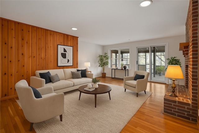 203 N Oklahoma Way, Fayetteville, AR 72701 - living room with light wood-style flooring, recessed lighting, wooden walls, and baseboards