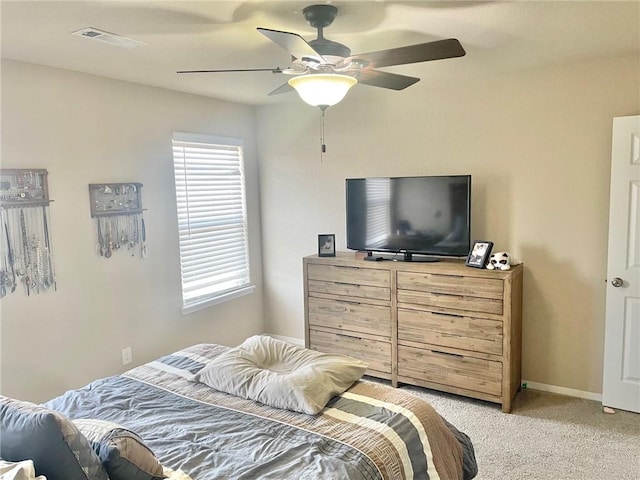 817 Evans Cir, Bentonville, AR 72713 - bedroom featuring visible vents, light colored carpet, baseboards, and ceiling fan