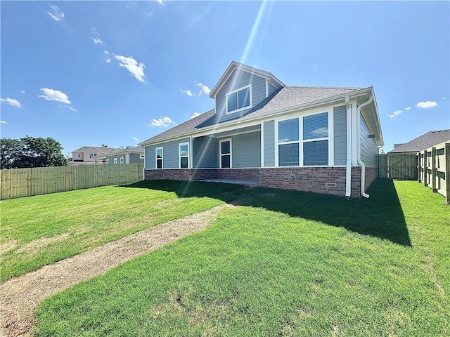 4903 SW Wakanda St, Bentonville, AR 72713 - back of property featuring a fenced backyard and brick siding
