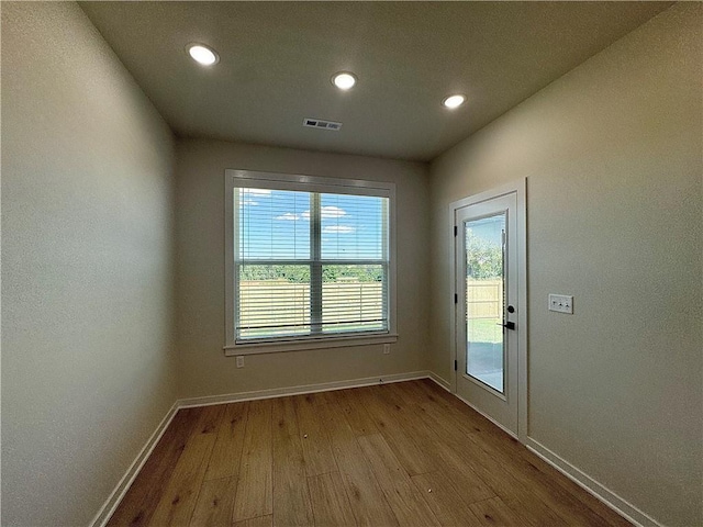 4903 SW Wakanda St, Bentonville, AR 72713 - unfurnished room with wood finished floors and recessed lighting