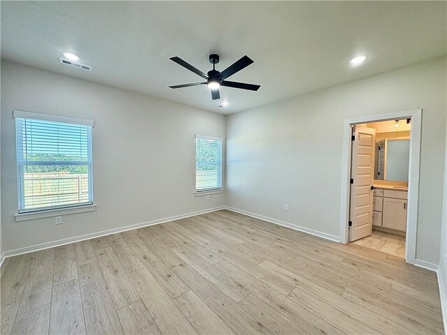 4903 SW Wakanda St, Bentonville, AR 72713 - unfurnished bedroom with light wood-style floors, recessed lighting, ceiling fan, and ensuite bathroom