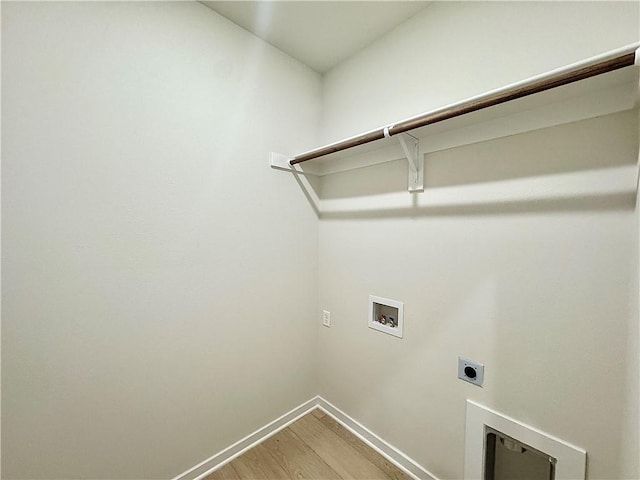 4903 SW Wakanda St, Bentonville, AR 72713 - washroom featuring hookup for an electric dryer, hookup for a washing machine, and light wood-style flooring