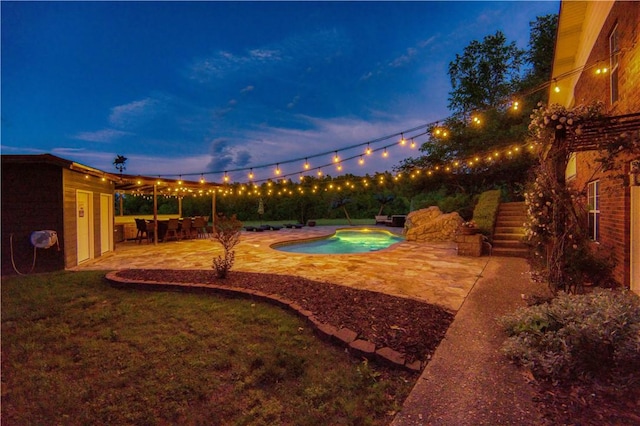 view of yard with an outdoor pool, a patio area, and stairway