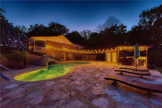 outdoor pool featuring a patio