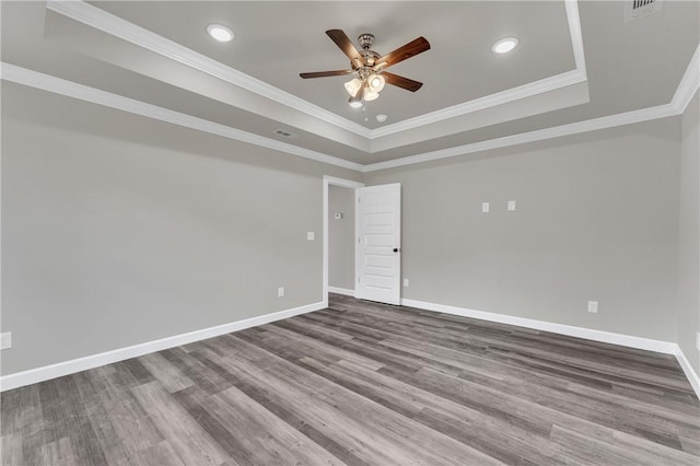 1328 San Miguel Dr, Springdale, AR 72762 - unfurnished room featuring ceiling fan, a raised ceiling, wood finished floors, crown molding, and baseboards