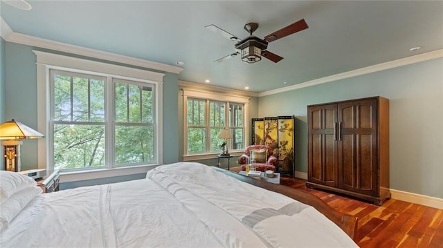 bedroom featuring ornamental molding, baseboards, wood finished floors, recessed lighting, and a ceiling fan