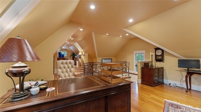 office space with light wood-type flooring, vaulted ceiling, recessed lighting, and baseboards